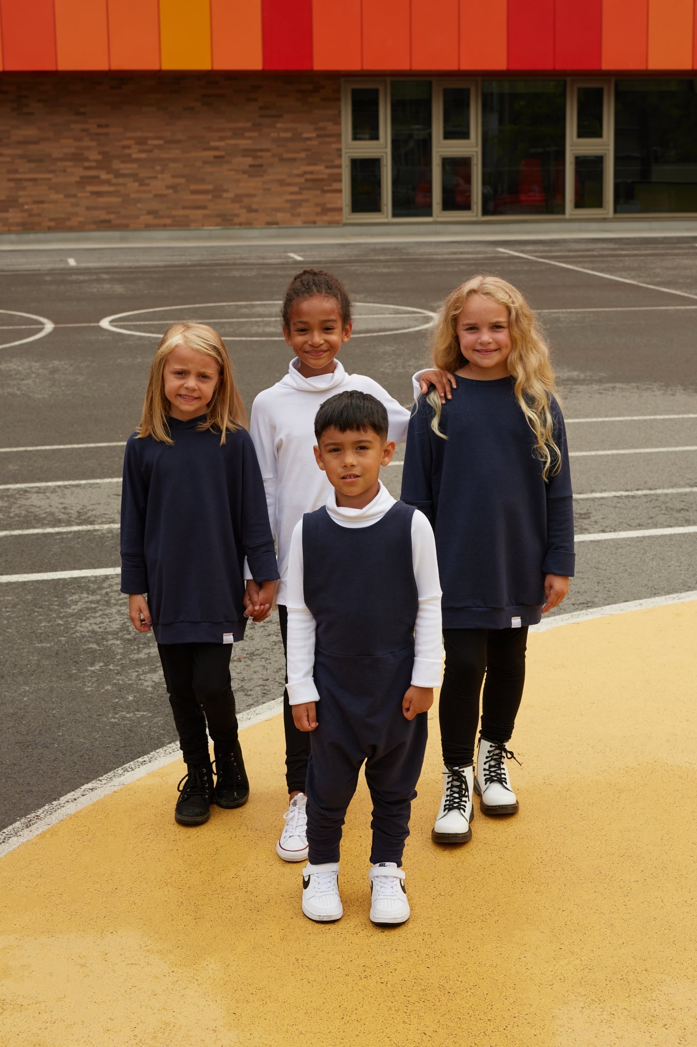 navy grow-with-me overalls for toddlers and kids, made from soft, eco-friendly fabric. Adjustable straps and cuffs for a long-lasting fit. Ethically made in Canada.