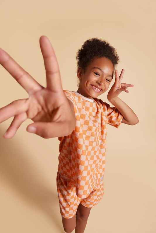 Discover our oversized Grow-With-Me T-Shirt – a gender-neutral, eco-friendly summer essential. Made from terry towel fabric, perfect after the beach, pool, or bath. Handmade in Montreal.