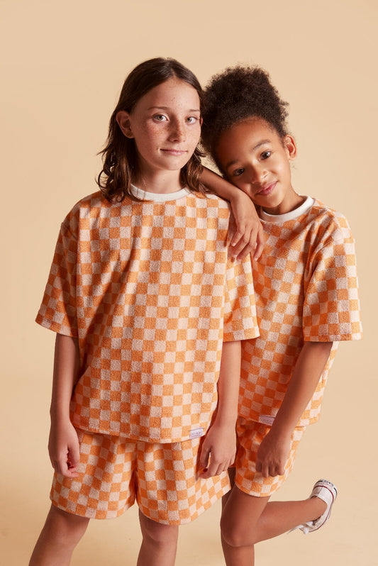 Discover our oversized Grow-With-Me T-Shirt – a gender-neutral, eco-friendly summer essential. Made from terry towel fabric, perfect after the beach, pool, or bath. Handmade in Montreal.