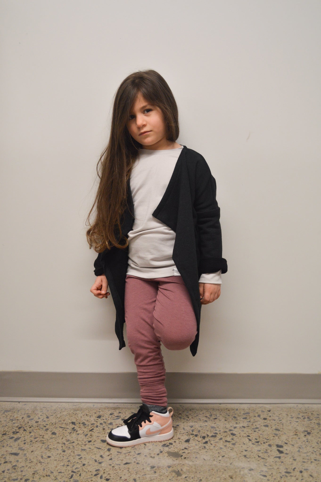 Black grow-with-me leggings for toddlers, made from soft, eco-friendly fabric. Adjustable waistband and cuffs for a long-lasting fit. Ethically made in Canada.