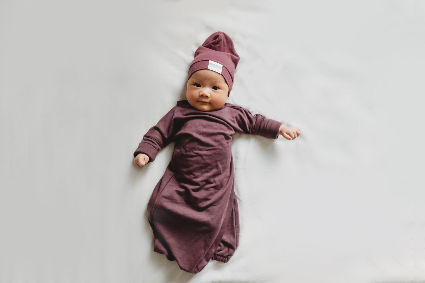 Soft and stretchy rose brown beanie for kids, made from eco-friendly fabric. Ethically crafted in Canada, featuring a fold-over brim and minimalist design