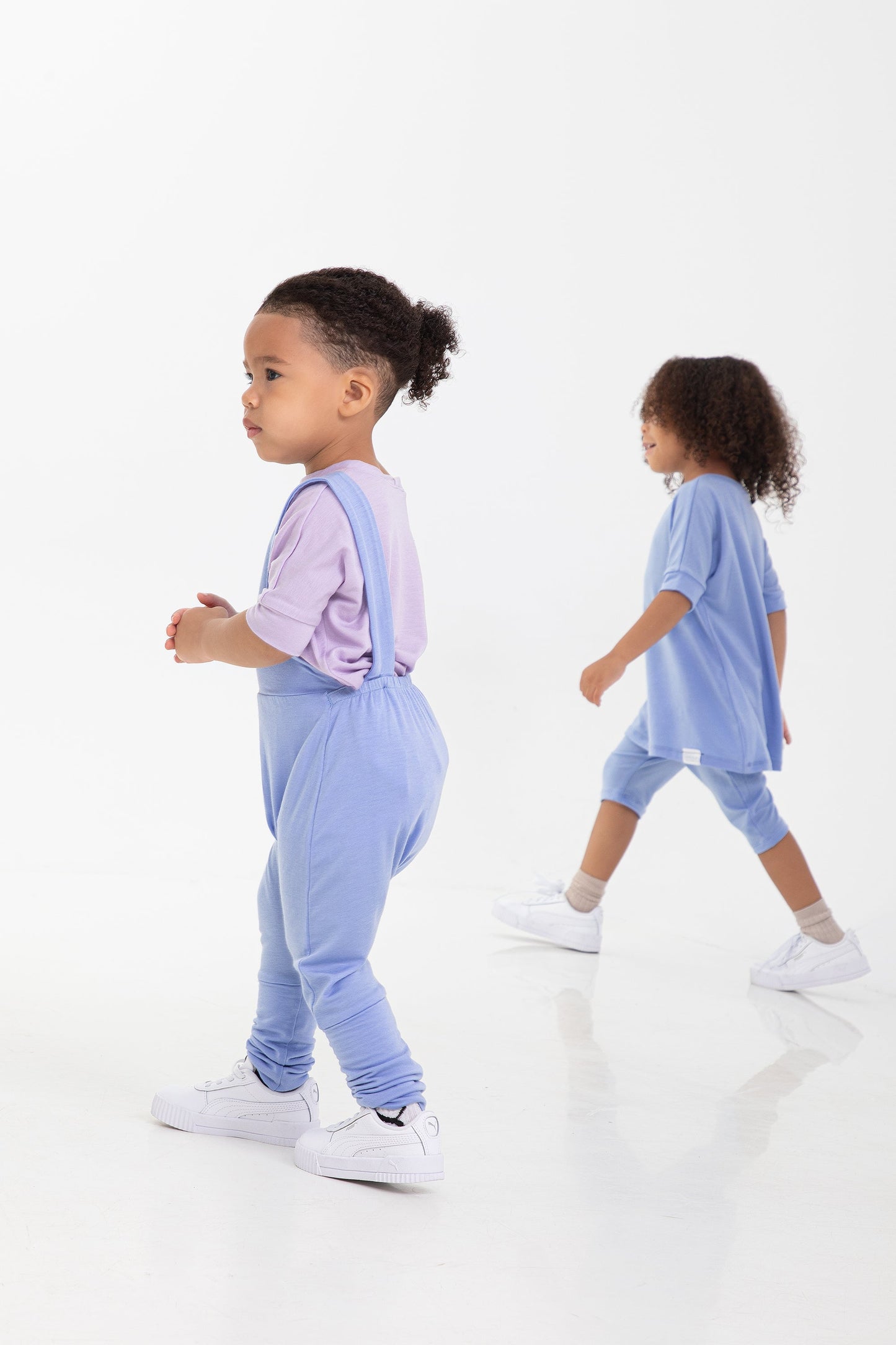 Waterlily grow-with-me t-shirt for kids, made from soft organic cotton with a stretchy, foldable waistband. Ethically made in Canada for a sustainable and comfy fit.