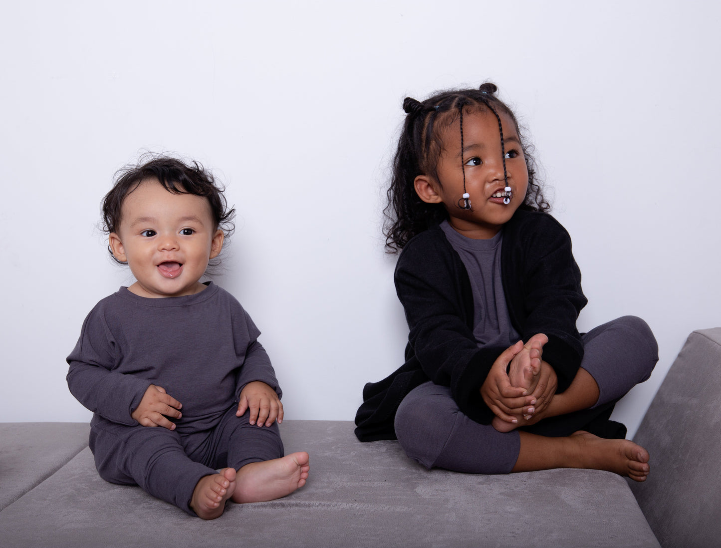 Dark Grey grow-with-me pants for toddlers and kids, made from soft, eco-friendly fabric. Adjustable waistband and cuffs for extended wear. Ethically made in Canada.