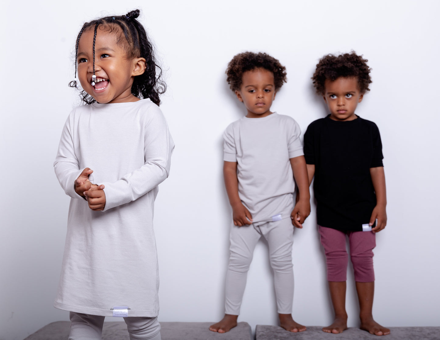 Taupe grow-with-me shirt for toddlers and kids, designed to be worn as a dress, tunic, or long shirt. Seamless shoulders and soft, eco-friendly fabric. Ethically made in Canada.