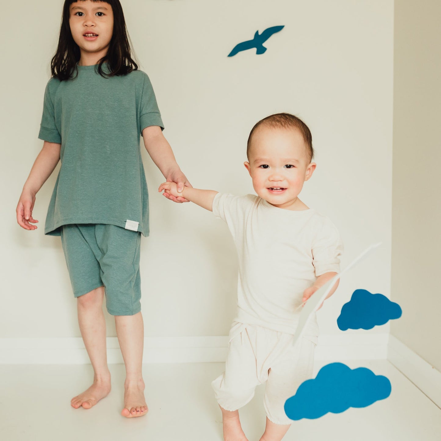Heather Cream grow-with-me t-shirt for kids, made from soft Lyocell. Ethically made in Canada for a sustainable and comfy fit.