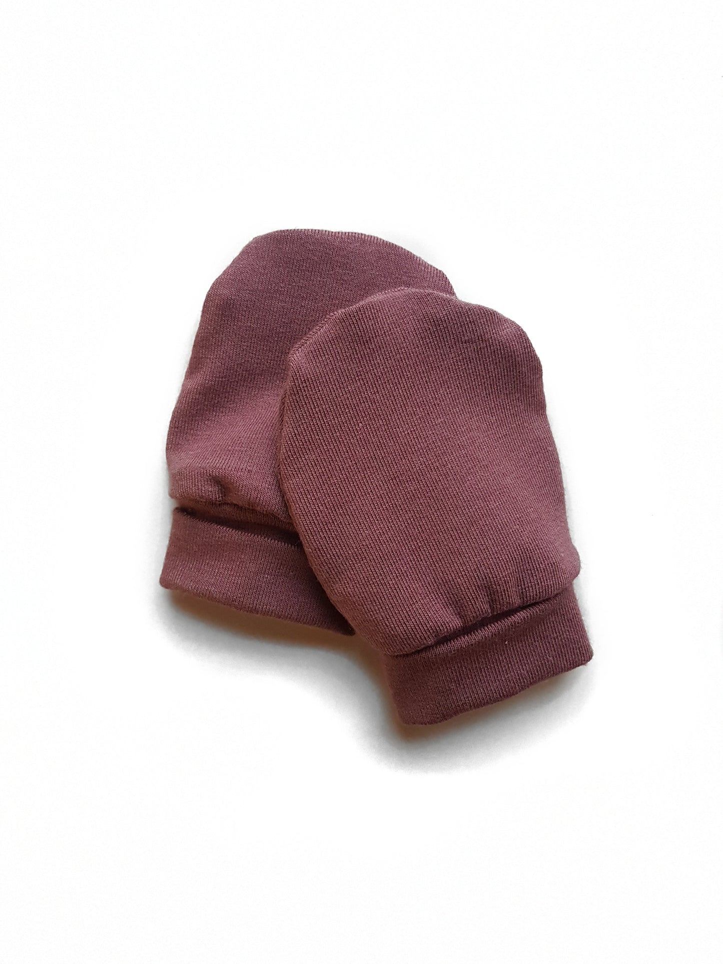 Soft and eco-friendly rose brown newborn mittens, designed to protect delicate skin and prevent scratching. Ethically made in Canada for ultimate comfort and warmth