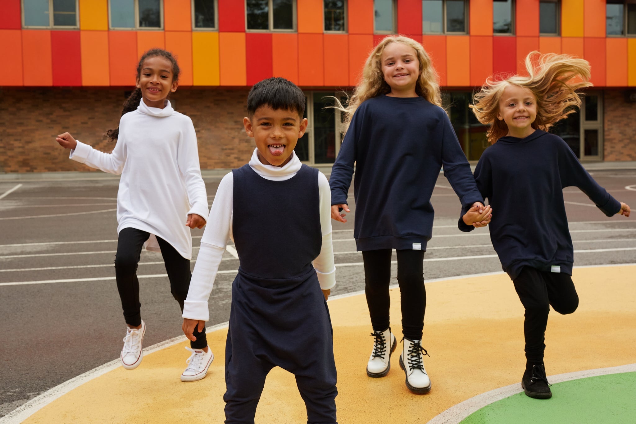 Eco-friendly kids' clothing – gender-neutral Navy grow with me sweater, sustainably made in Canada.