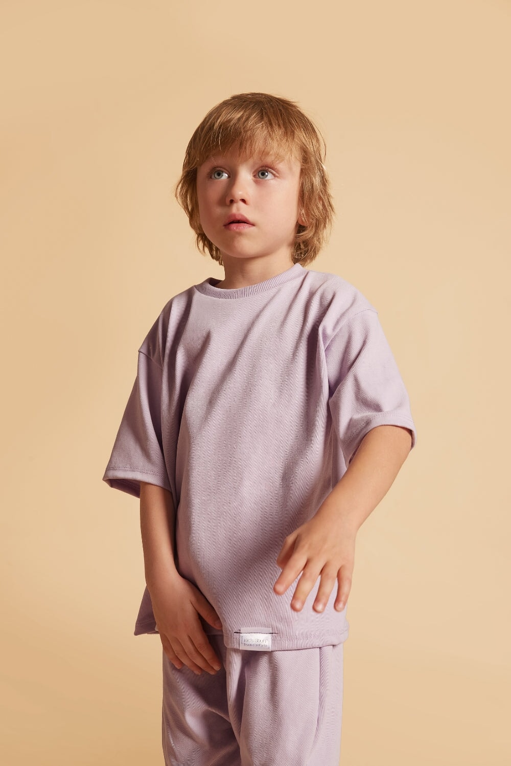 Oversized Grow-With-Me T-Shirt – a gender-neutral, eco-friendly essential for kids. Handmade in Montreal, designed for comfort and longevity.