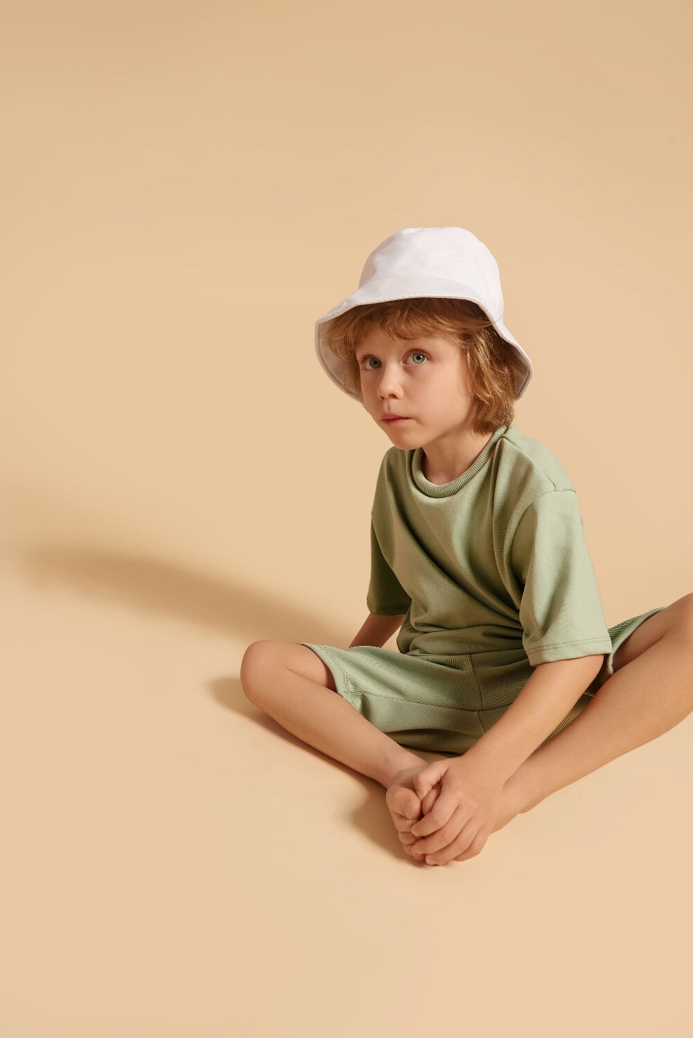Discover our oversized Grow-With-Me T-Shirt – a gender-neutral, eco-friendly essential for kids. Handmade in Montreal, designed for comfort and longevity.