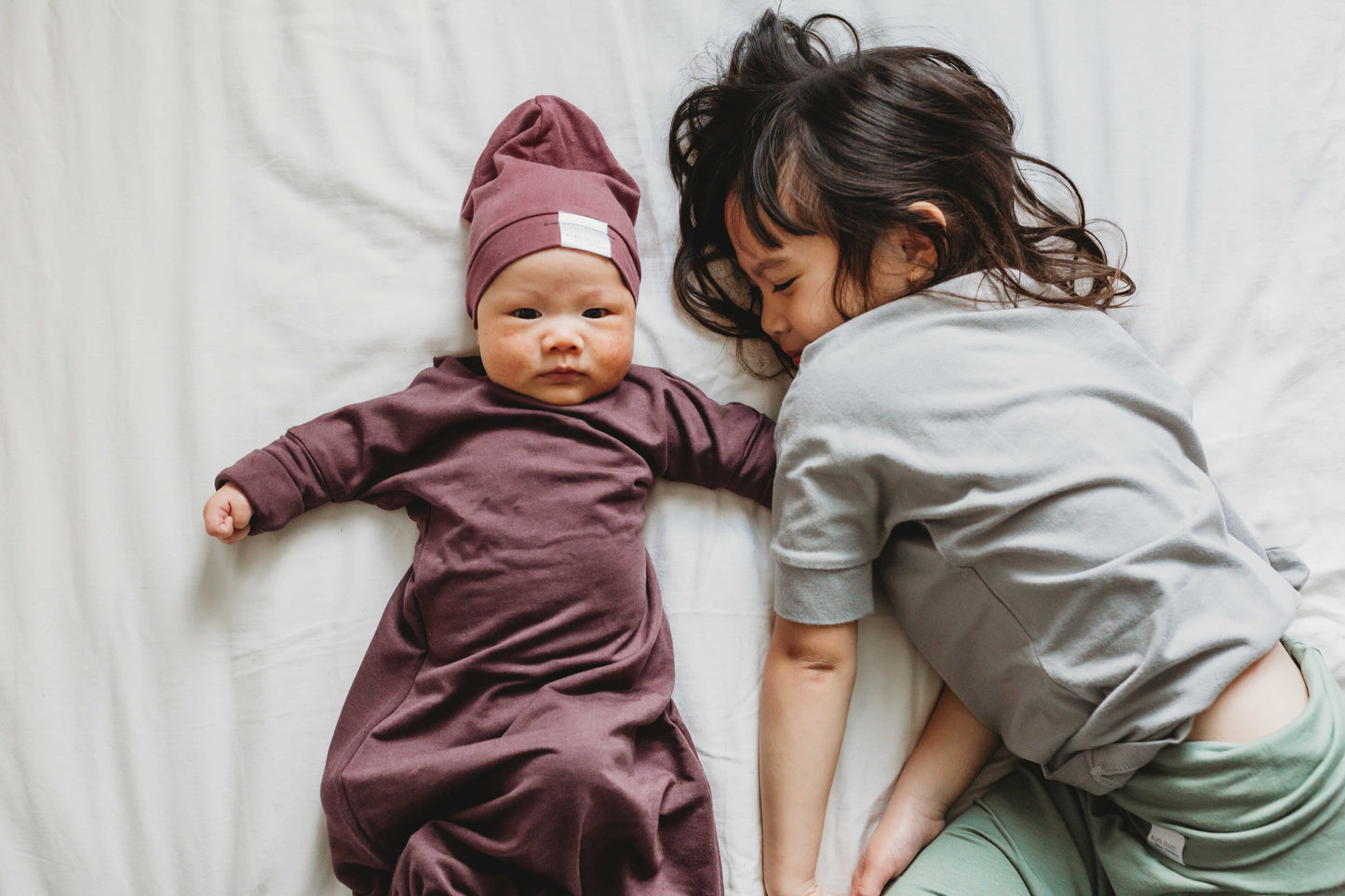 Soft and stretchy rose brown beanie for kids, made from eco-friendly fabric. Ethically crafted in Canada, featuring a fold-over brim and minimalist design