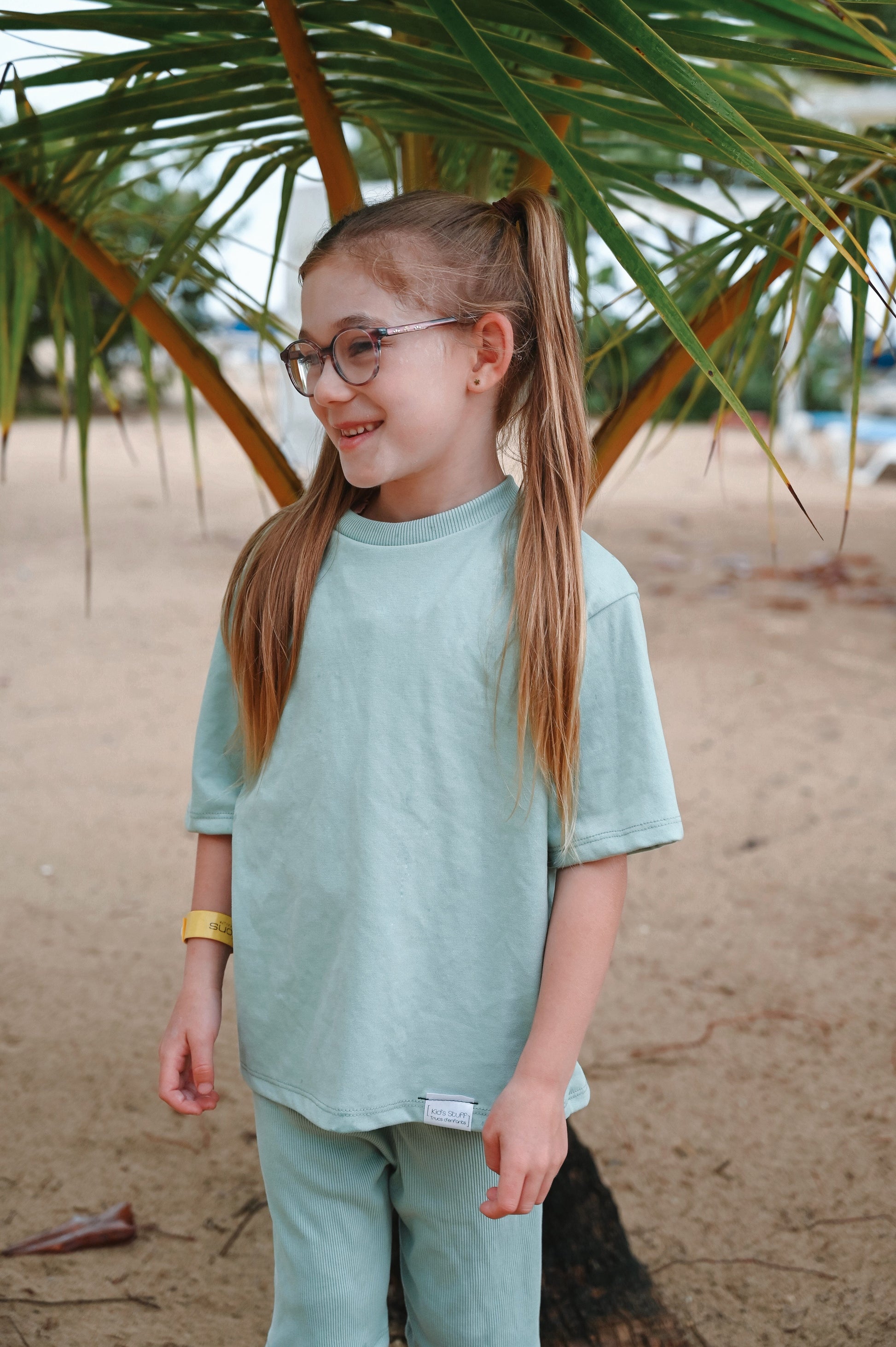 Mint green oversize kids t-shirt and biker shorts made in Canada with eco-friendly fabric designed to grow with your child