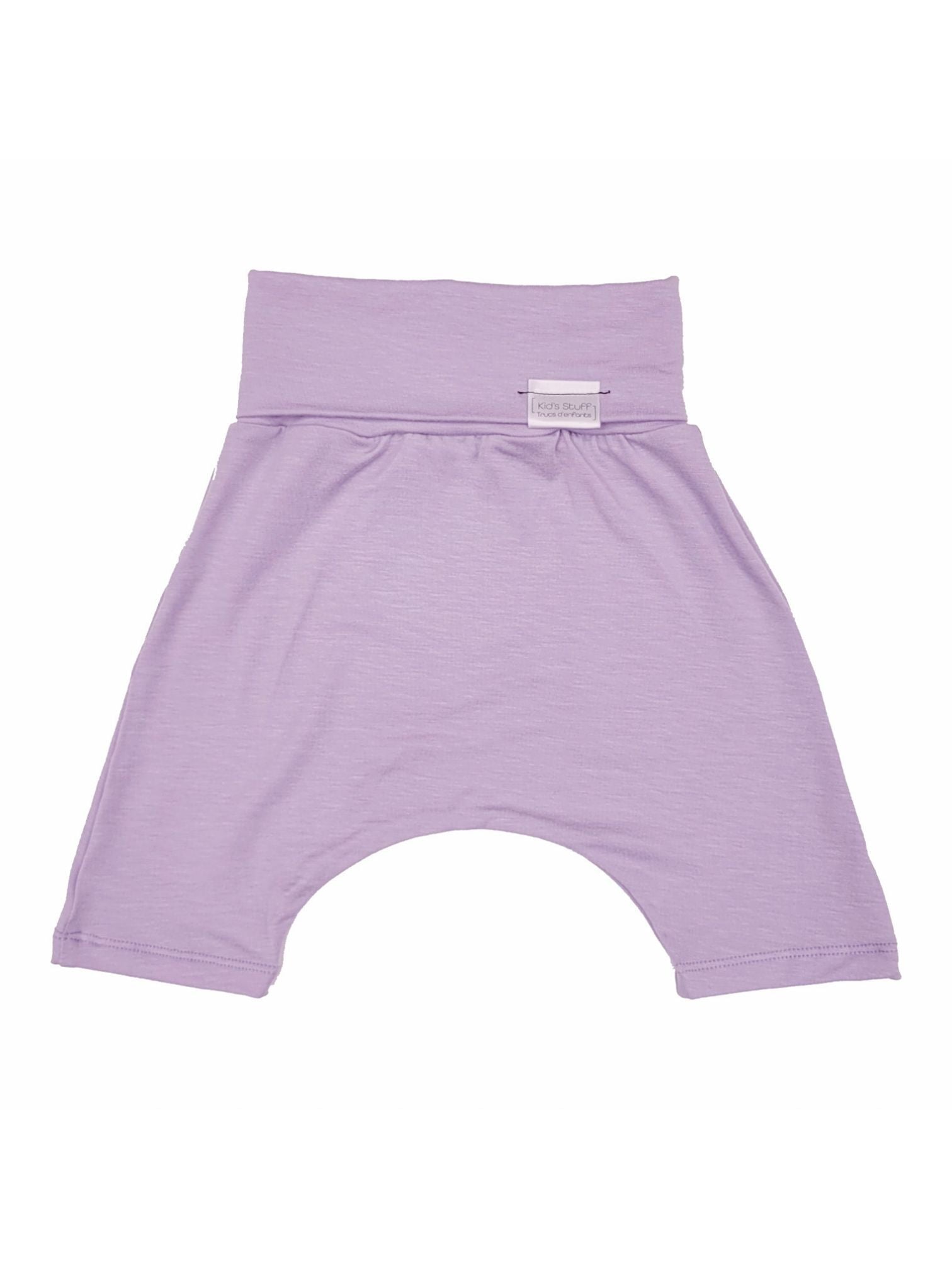 Waterlily grow-with-me shorts for kids, made from soft organic cotton with a stretchy, foldable waistband. Ethically made in Canada for a sustainable and comfy fit.