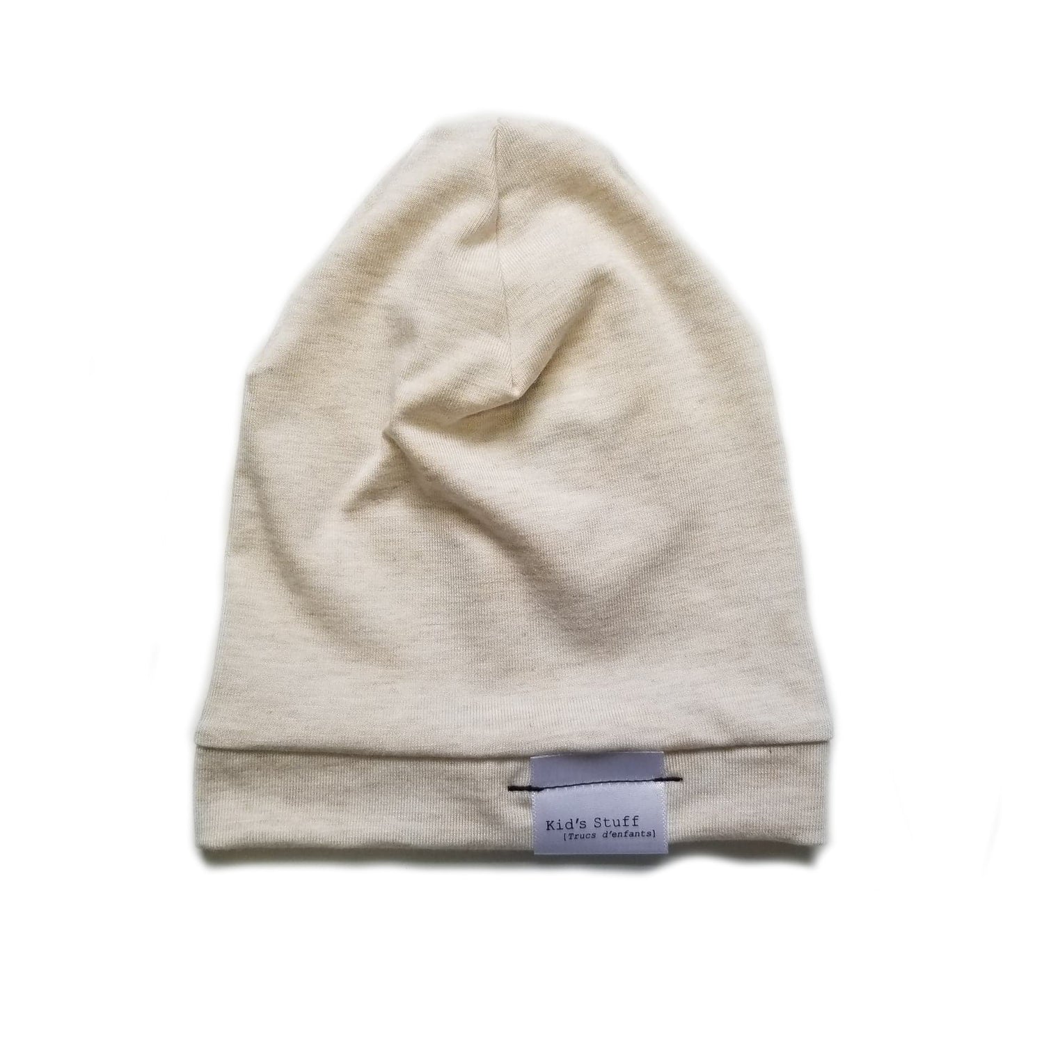 Soft and stretchy heather cream beanie for kids, made from eco-friendly fabric. Ethically crafted in Canada, featuring a fold-over brim and minimalist design