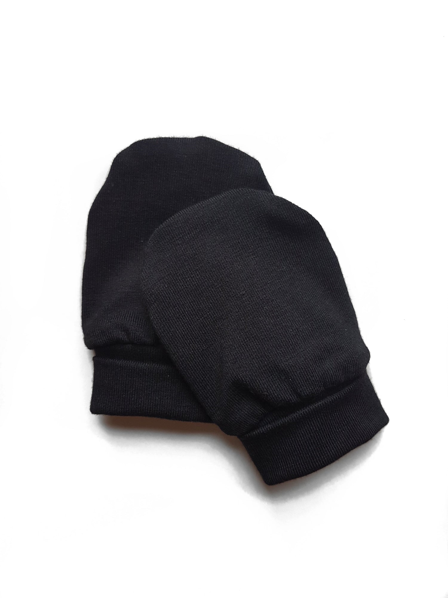 Soft and eco-friendly black newborn mittens, designed to protect delicate skin and prevent scratching. Ethically made in Canada for ultimate comfort and warmth