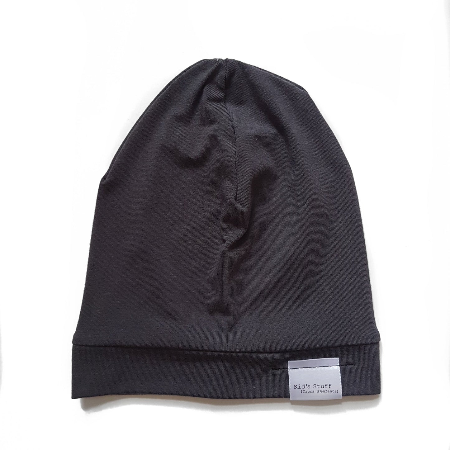 Soft and stretchy dark grey beanie for kids, made from eco-friendly fabric. Ethically crafted in Canada, featuring a fold-over brim and minimalist design